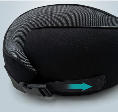 Close-up of the clip buckle on a black travel neck pillow