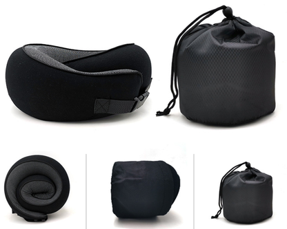 Black travel neck pillow next to its storage bag